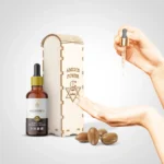 "Glass dropper bottle of Moroccan argan oil used for glowing, healthy skin care"